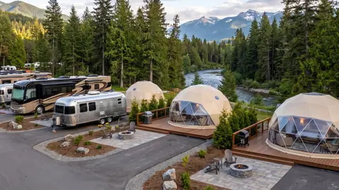Glamping domes and travel trailers at an RV resort