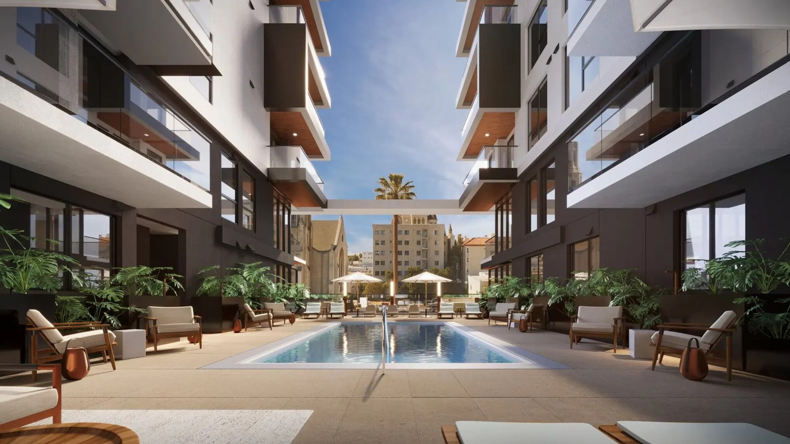 Residential courtyard with a pool between two building wings