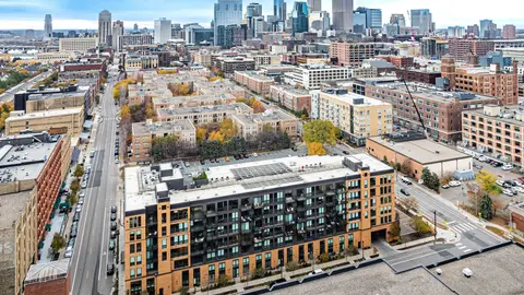 Urban infill district illustrating a vertical warehouse site plan concept in a dense U.S. city, highlighting land constraints, mixed-use surroundings, and the shift toward taller industrial development.