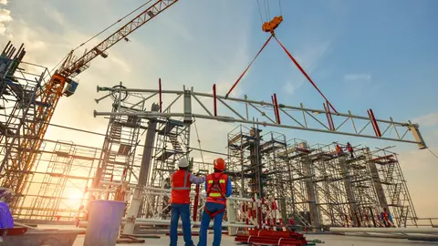 Steel frame being installed during early-stage commercial construction.