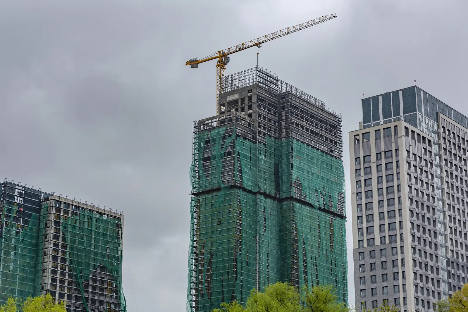 Mid-construction commercial tower, the stage that follows permit issuance