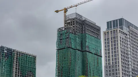 Mid-construction commercial tower, the stage that follows permit issuance