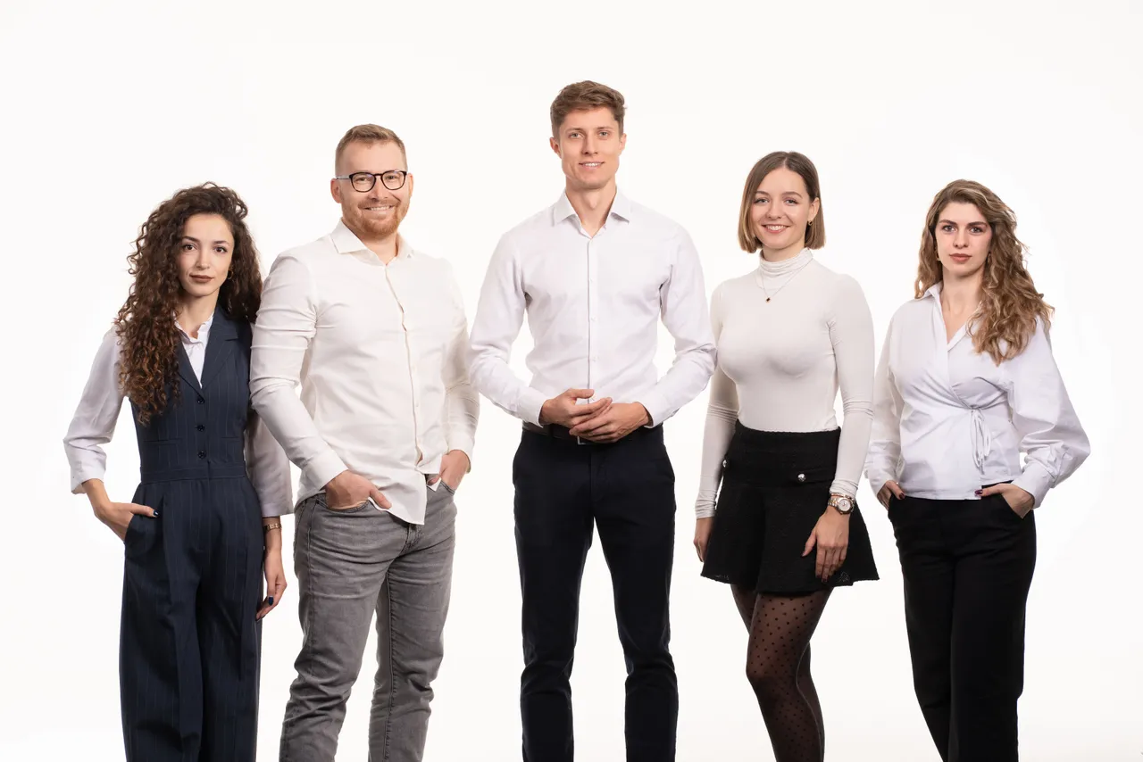 Innowave Studio team portrait, five people standing on a white background