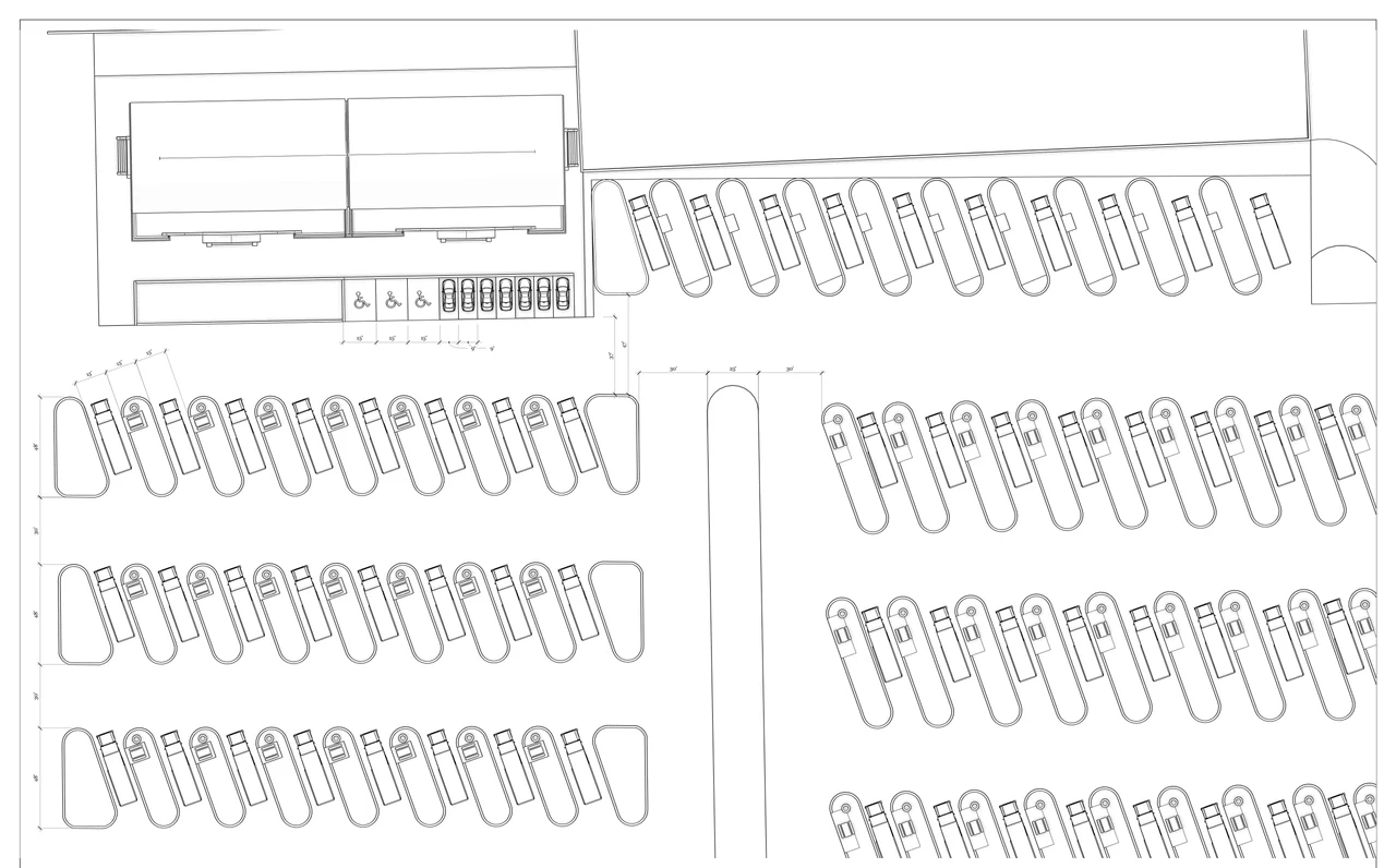 Studio drawing of an RV park pad layout: rows of angled pull-through RV pads along drive aisles, beside an amenity building with accessible parking stalls